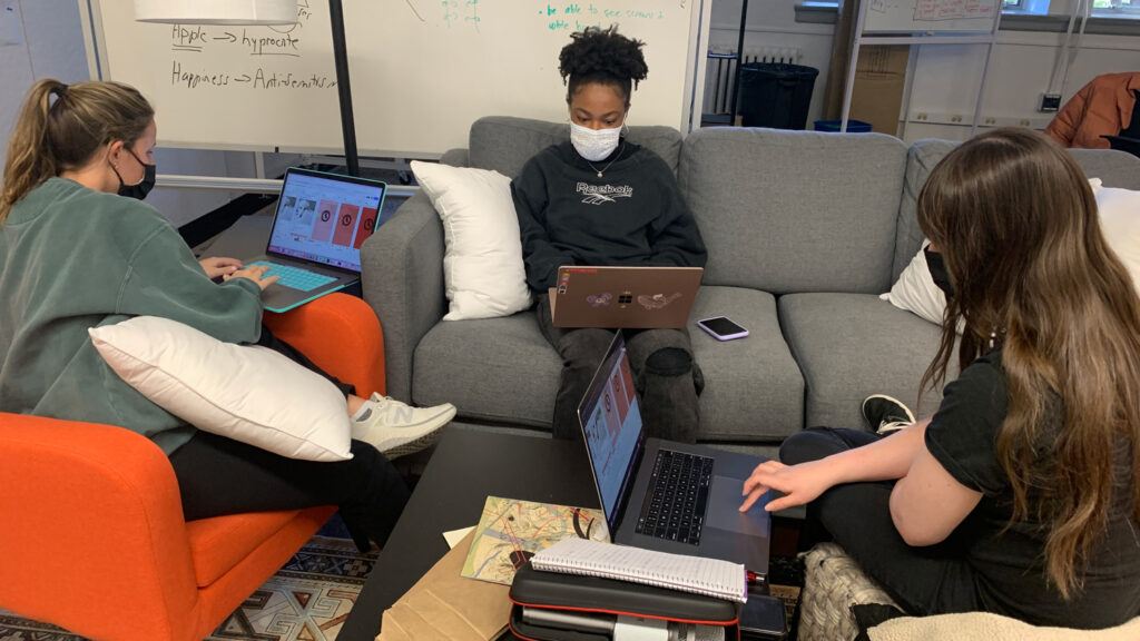 students working on couch