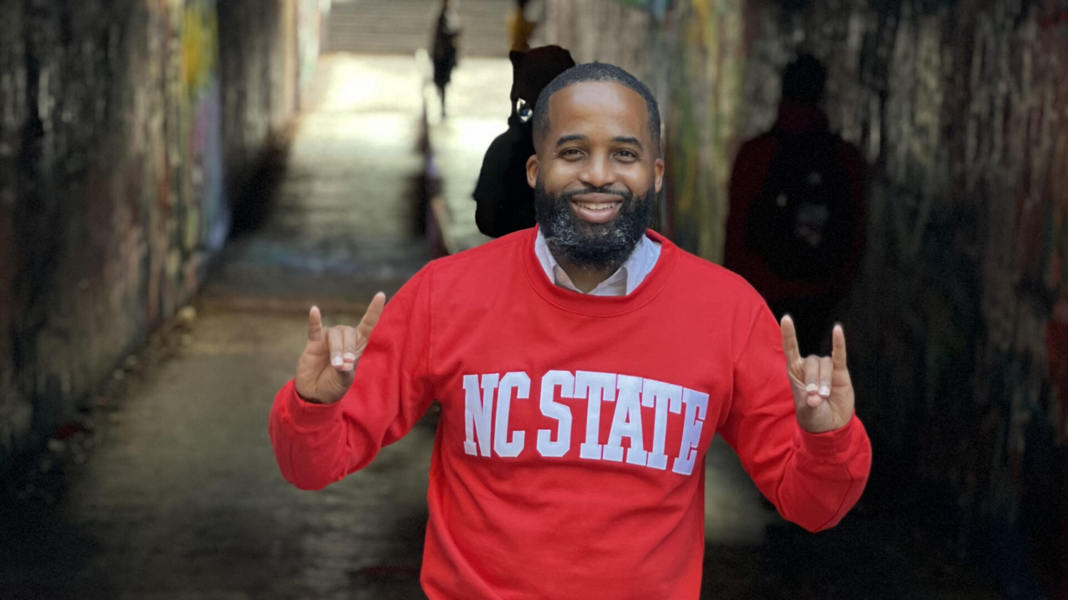 Demarcus Williams does the Wolfie in the Free Expression Tunnel