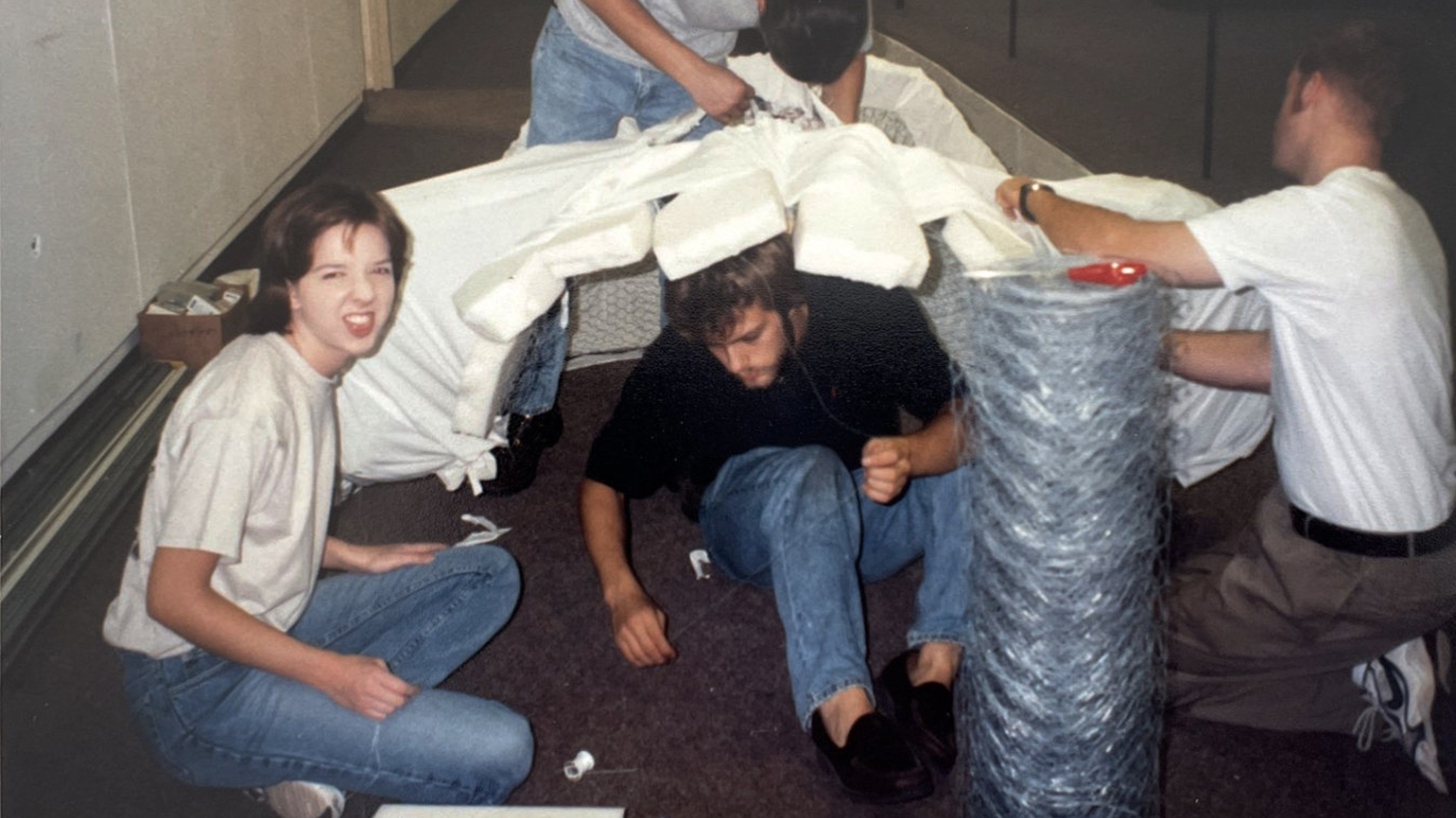 Mary Hauser prepares for the Halloween Bash at the College of Design alongside fellow students.