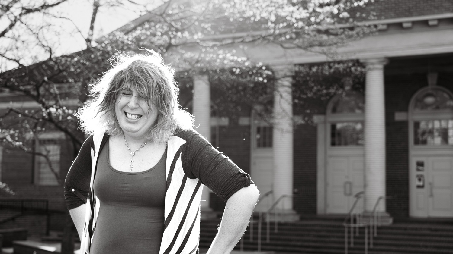 Portrait of Luna Vanaman in front of Leazar Hall at NC State.