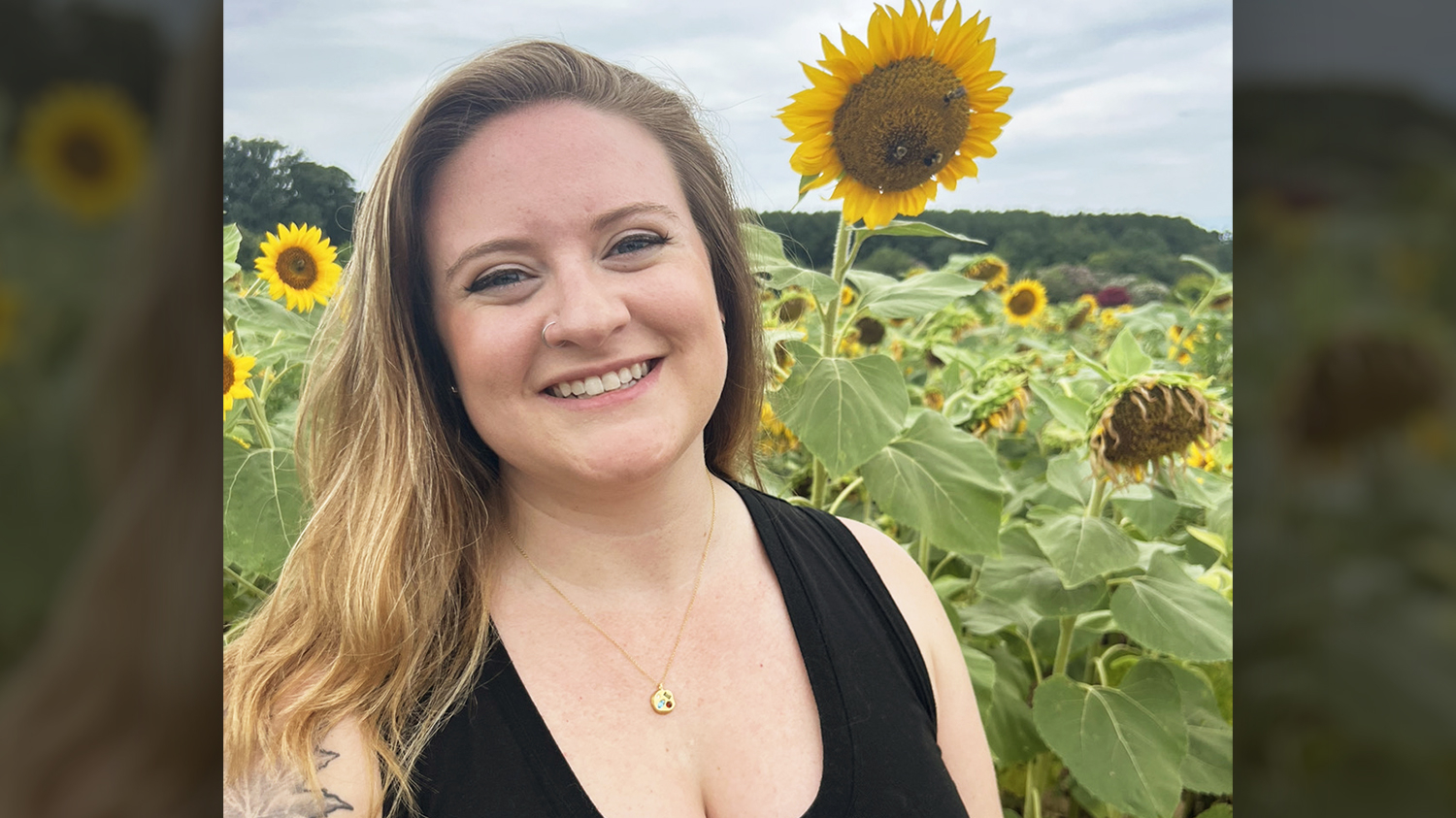 Portrait of Emily Burdo outside with sunflowers