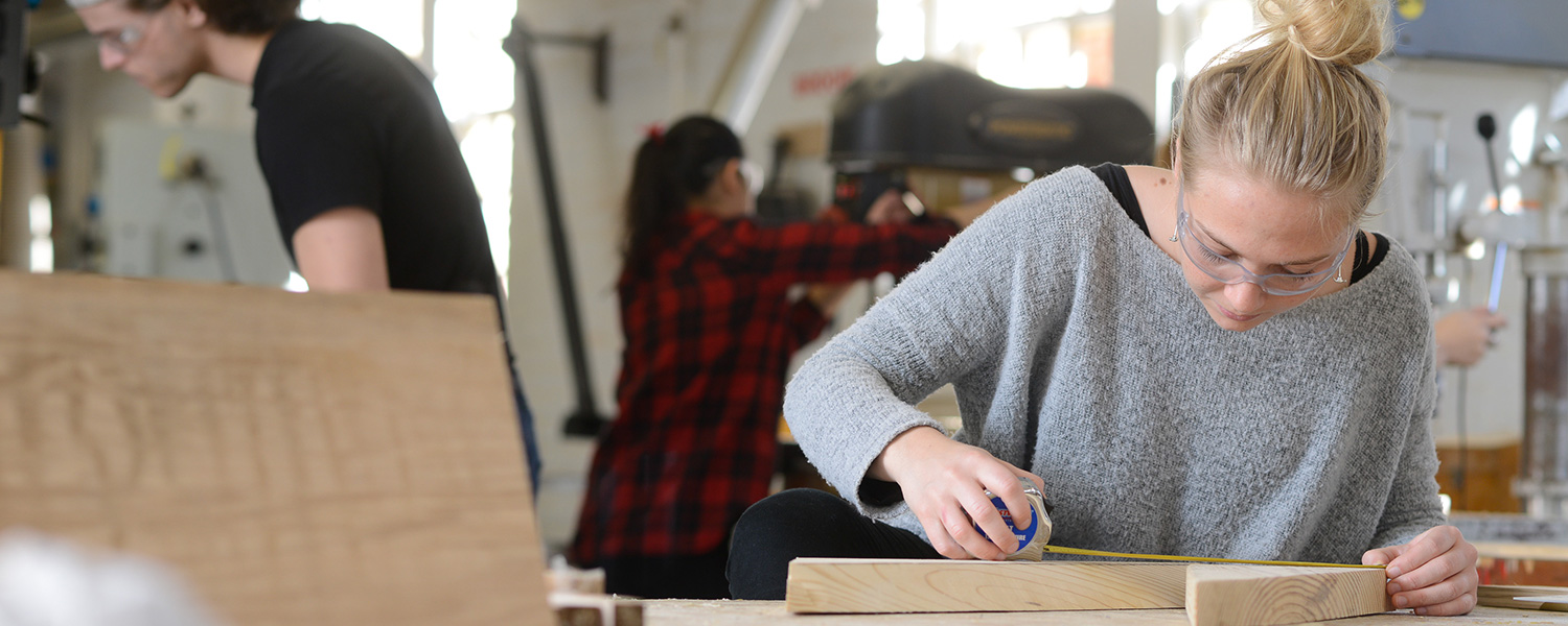 Student works on a project in the woodworking lab