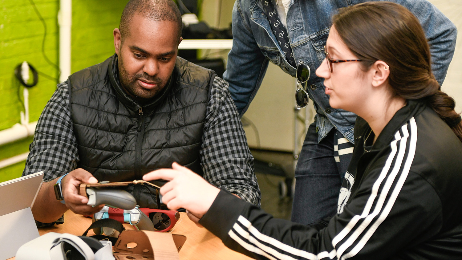 Teacher and student exploring new technology