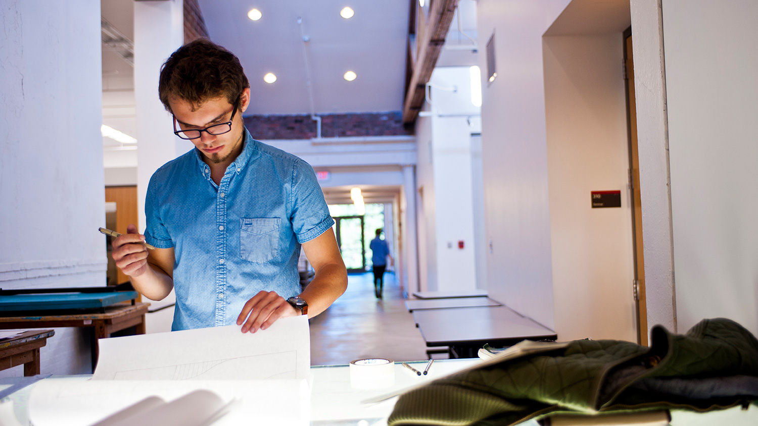 Student works at light table