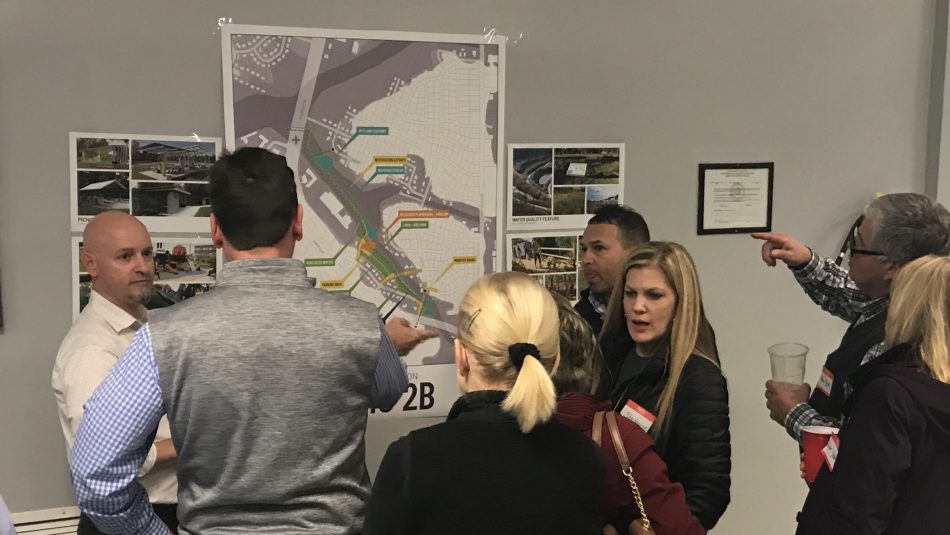 Andrew Fox talks to residents about a mitigation alternative at a recent community workshop in Lumberton.