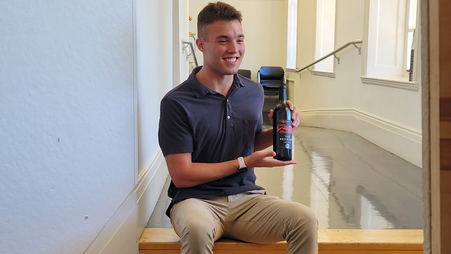 Carter Avayou with Shelton Vineyards the Brickyard wine bottle