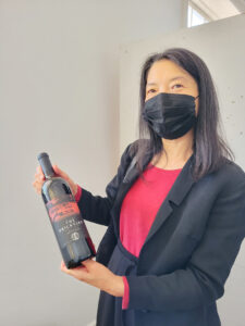 Victoria Chi with Shelton Vineyards the Brickyard wine bottle