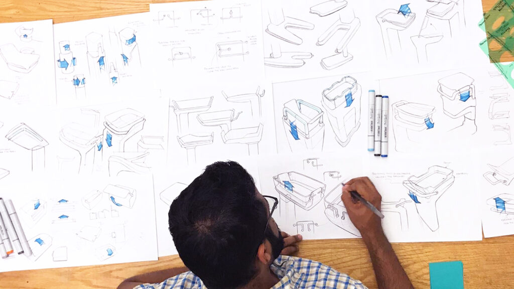 Prasad Joshi with concepts he generated during the first round of ideation for the bassinet.