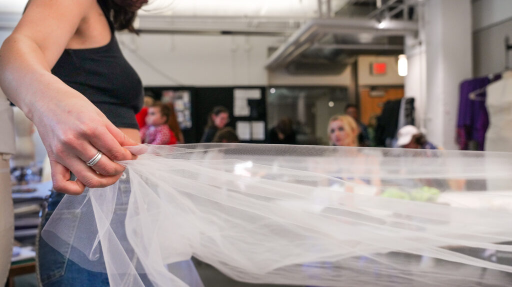 student working with fabric