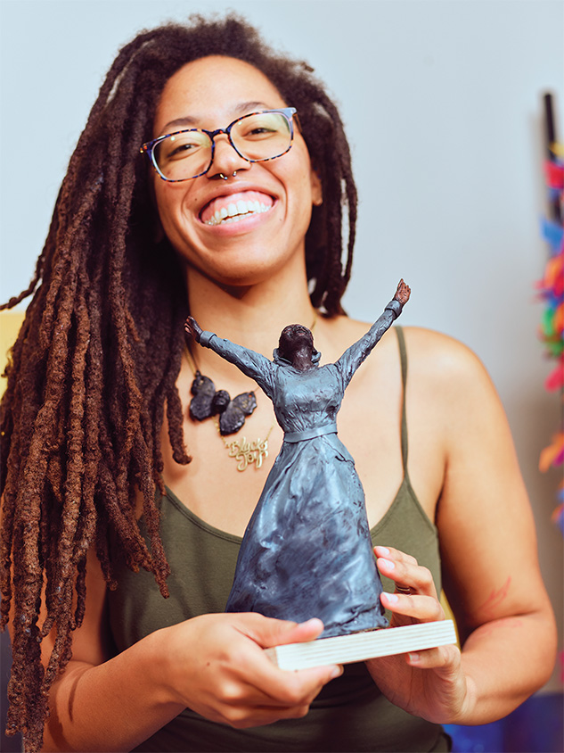 Coulter with one of her favorite sculptures she created for An American Story. Photograph by Joshua Steadman.