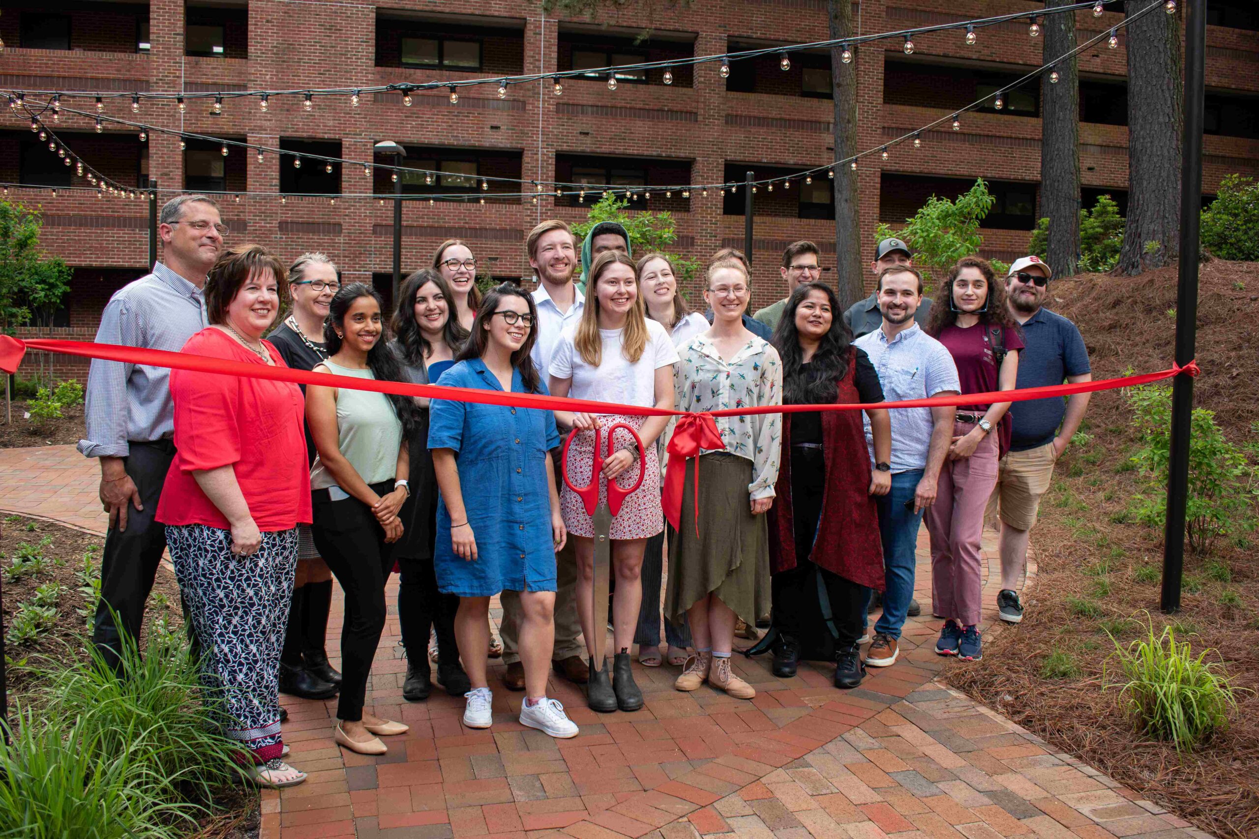 LAR 506 students, professors and community partners pose in front of the new Wood Hall redesigned area