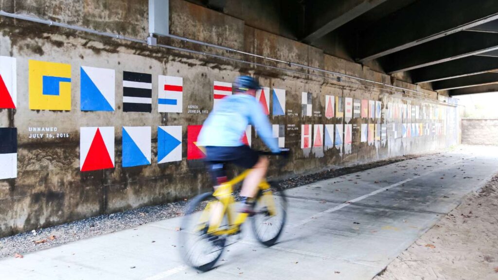 cyclist riding on greenway underpass