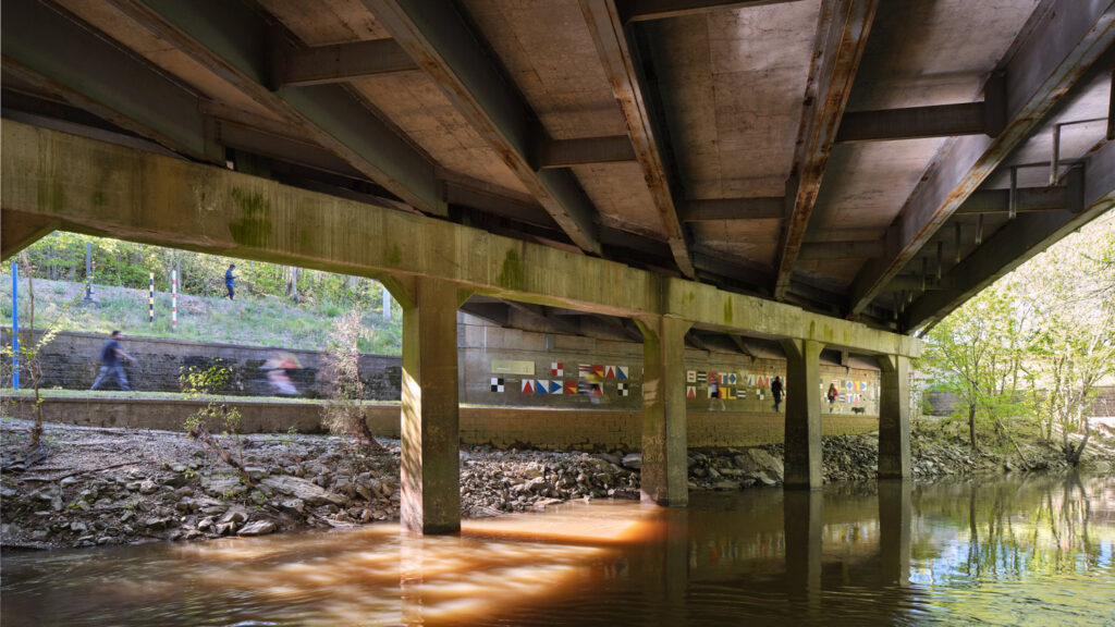 Photo of alluvial decoder under underpass with creek water below