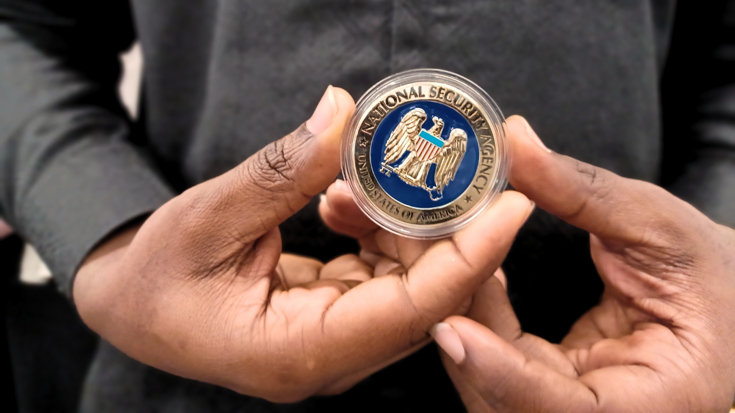 hands holding coin