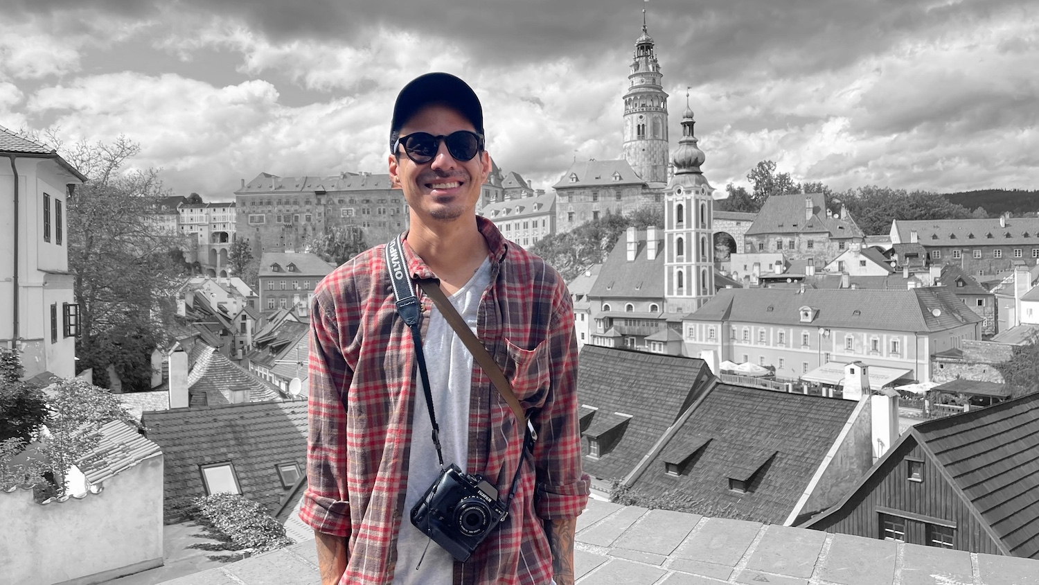 Xzavier Taylor standing against the Prague skyline during a study-abroad trip supported by scholarship funding. Photo provided.