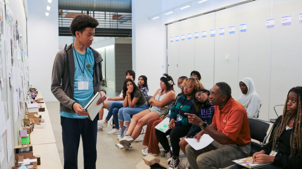 Student presents project to Charles Joyner in 2023 as part of Design Camp.