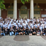 Students from Design Camp 2024 celebrate another year of successful programming. Campers are pictured in white t-shirts, while support staff wear black in the first row.
