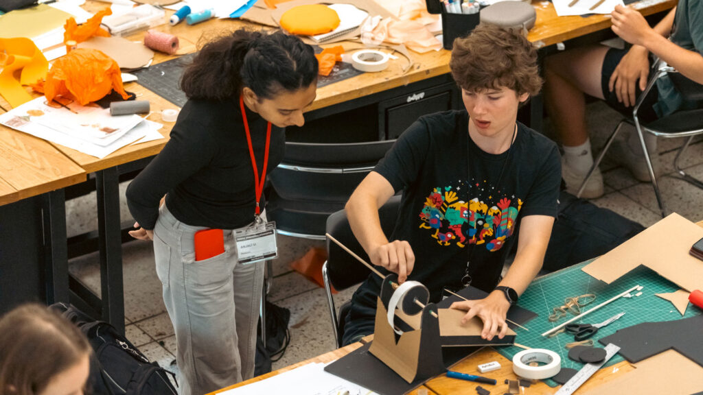 Student shows off project from Design Camp 2024.
