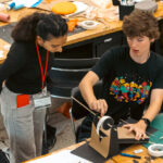 Student shows off project from Design Camp 2024.
