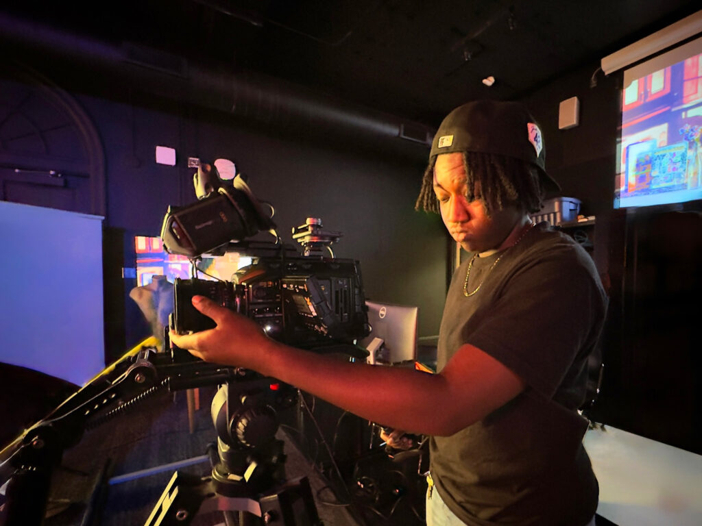 student operating camera