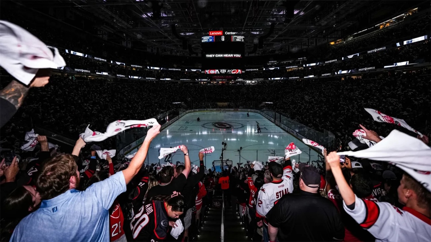 Carolina Hurricanes fans stand and wave white towels during the pregame ceremonies