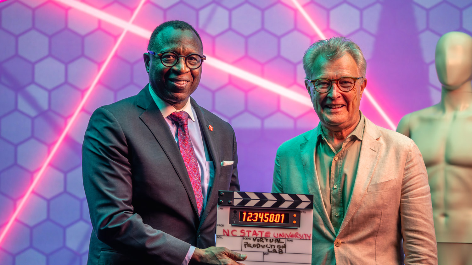Chancellor Howell and Dean Hoversten in front of LED wall in virtual production lab