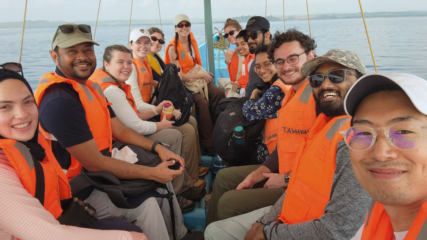 Architecture students pose on a boat in Kenya