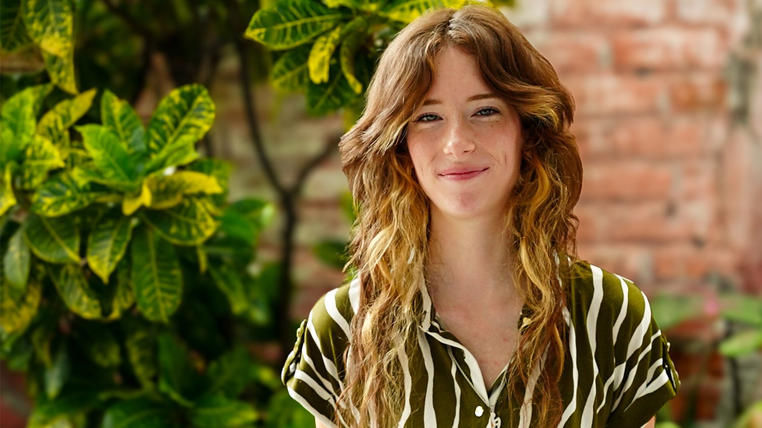 Smiling woman with wavy hair